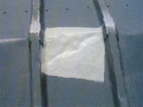 Repair patch on the hull of a boat.