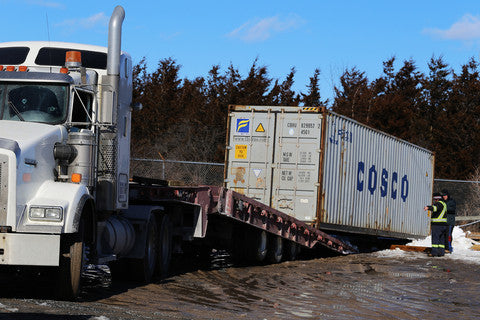 Container placement and unloading with tilt truck