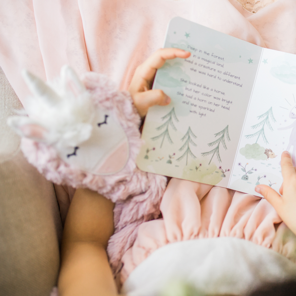 Child read Unicorn&#039;s board book to Unicorn kin