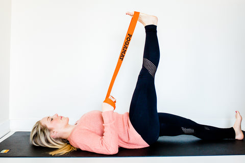 Reclined hand to big toe pose with yoga strap