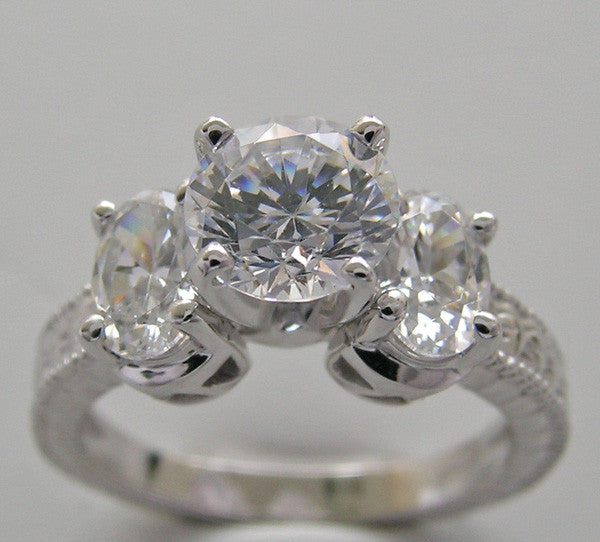 ROUND AND OVAL SHAPE THREE STONE RING SETTING