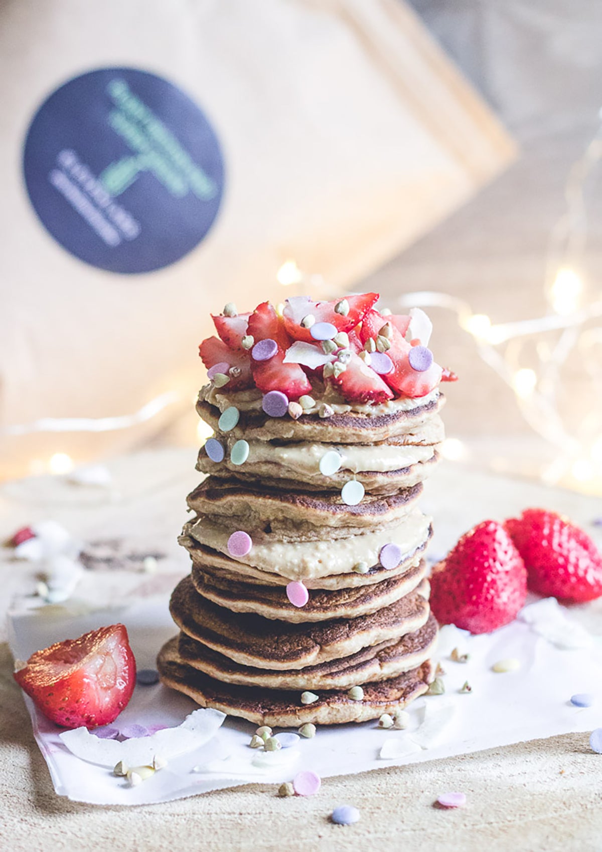 elevenlabs nourishing plant protein pancakes stacked with cashew cream and strawberries