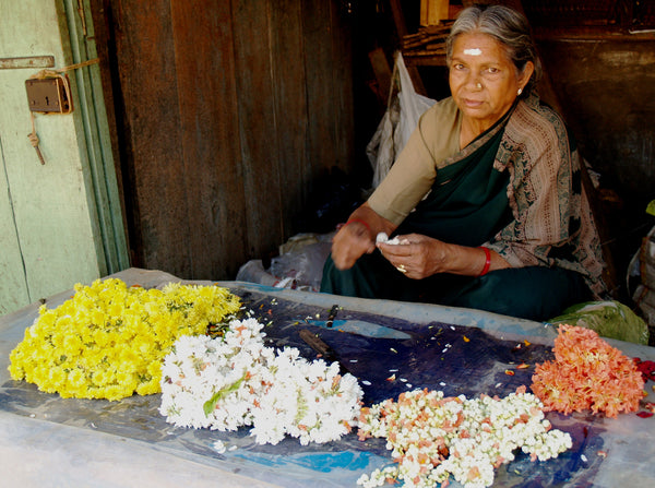 old woman selling flowers