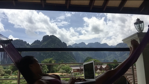 Nicole Fu working remotely in Van Vieng, Laos