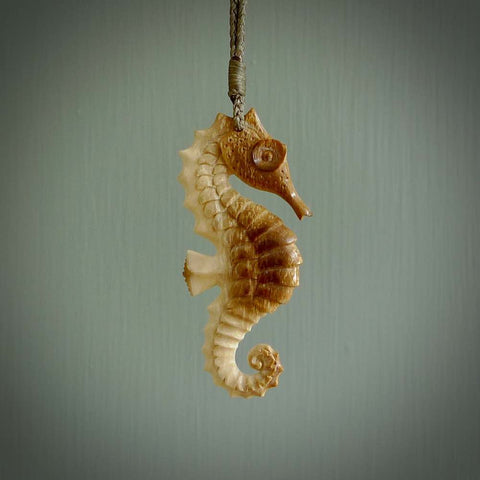 Hand carved mammoth tusk seahorse pendant. Handmade jewellery for sale online.