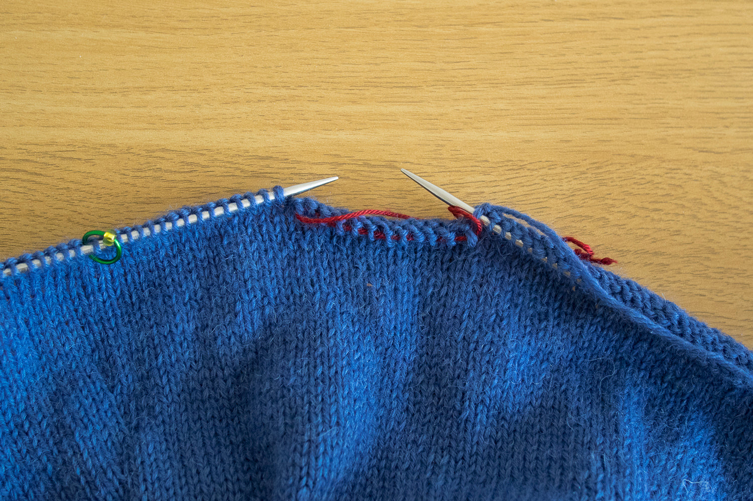 close up of the underarm stitches on waste yarn