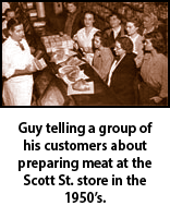 Guy Dickens telling a group of his customers about preparing meat at the Scott St. store in the 1950s.