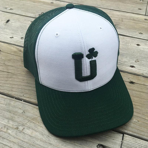 A green and white mesh hat with the UPTOP logo and a shamrock.