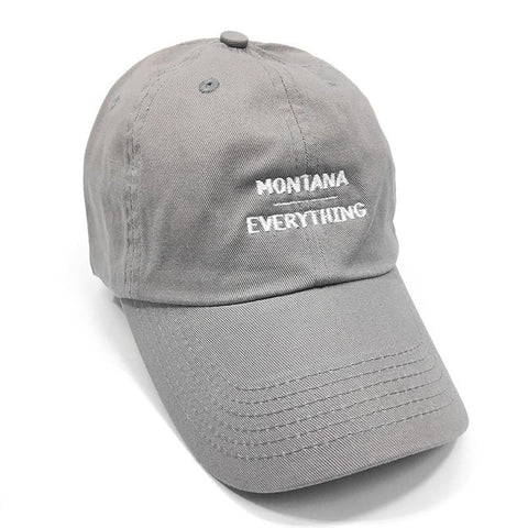 A grey hat that says Montana, with a line under it and Everything below it in white lettering.