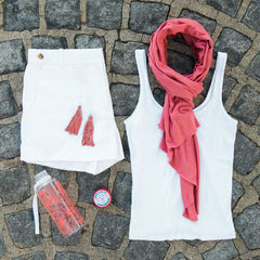 Sun safe Sol O scarf paired with white shorts and white tank top 