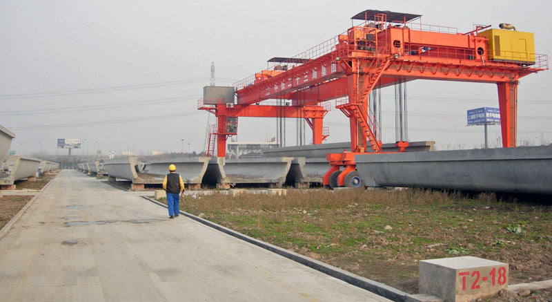 Full-span precasting of light-rail transit bridges