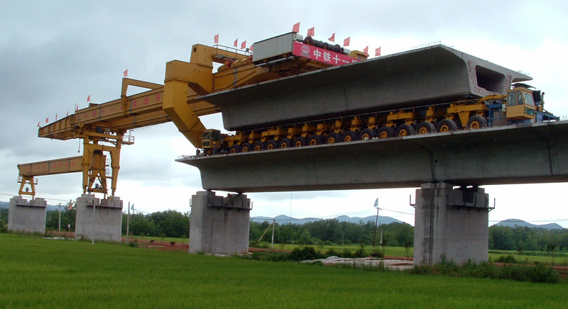 Full-span precasting of high-speed railway bridges