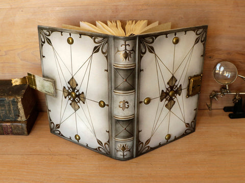 White leather and brass journal