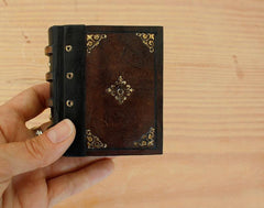 miniature book with gold tooling