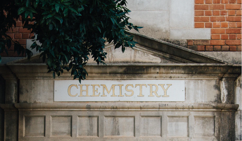 a roman building with the word chemistry etched into the title above the columns