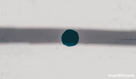 a blue paint circle with a gray line shadow and a white background