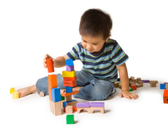 A child stacking blocks.