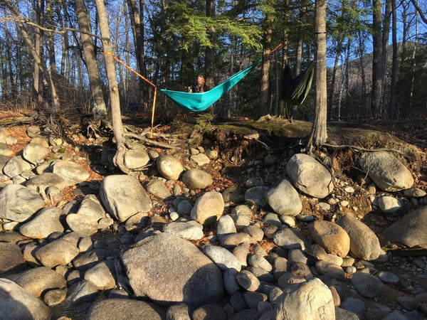 hammocking above a rocky shore