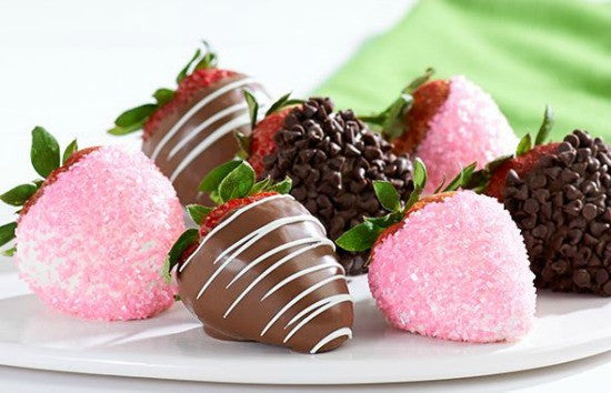 candied and chocolate covered strawberries on a platter