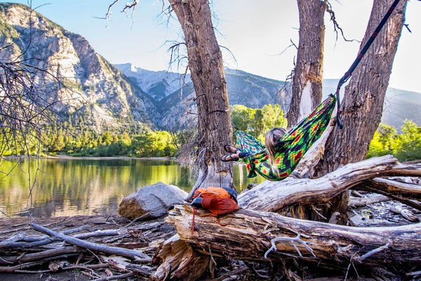 hammocking next to a mountain lake