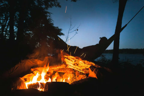 Hammocking next to a lit campfire