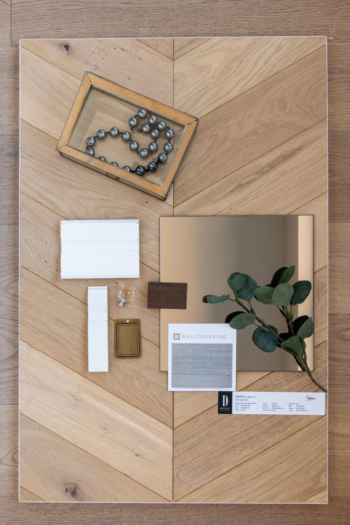 Material flat lay by SmithErickson design for the Parisian apartment styled vignette in the Calgary flagship showroom by Divine Flooring