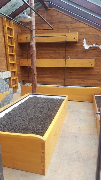 Self-Watering elevated greenhouse garden. Cedar raised beds, container gardens, and veggie/vegetable gardens featuring GardenWell sub-irrigation to create wicking beds for growing your own food.
