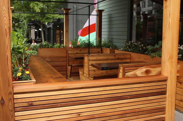 Self-Watering elevated restaurant garden. Cedar raised beds, container gardens, and veggie/vegetable gardens featuring GardenWell sub-irrigation to create wicking beds for growing your own food.