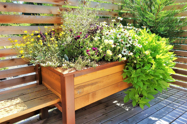 Self-Watering elevated deck, patio, and balcony garden. Cedar raised beds, container gardens, and veggie/vegetable gardens featuring GardenWell sub-irrigation to create wicking beds for growing your own food.