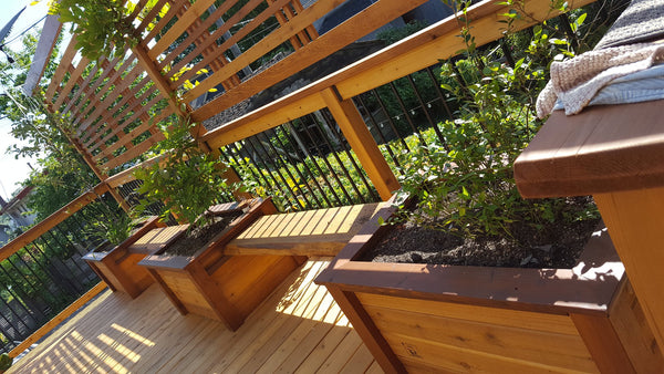 Self-Watering elevated deck, patio, and balcony garden. Cedar raised beds, container gardens, and veggie/vegetable gardens featuring GardenWell sub-irrigation to create wicking beds for growing your own food.