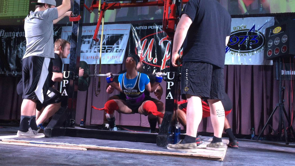 Woman, powerlifter, squatting