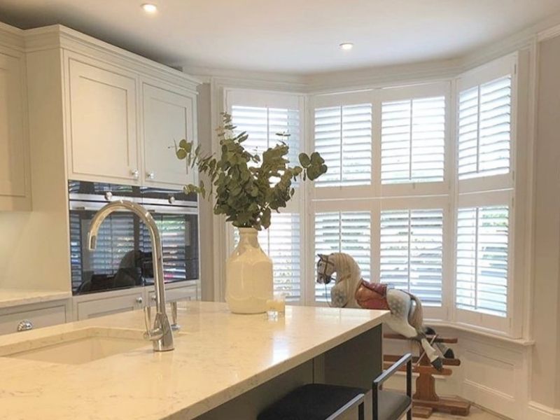 waterproof shutters in a bay window kitchen