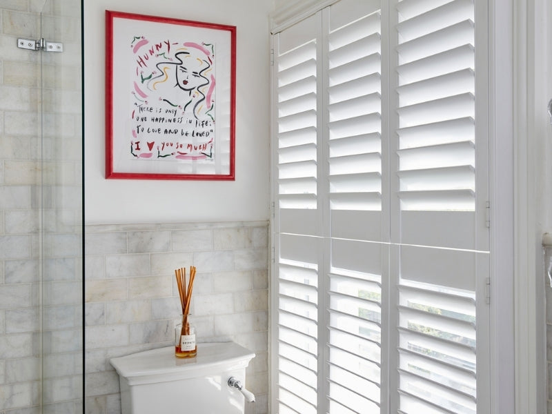 bathroom with closed shutters