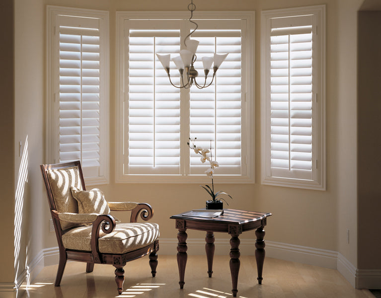 lights entering through half open louvres of bay window shutters