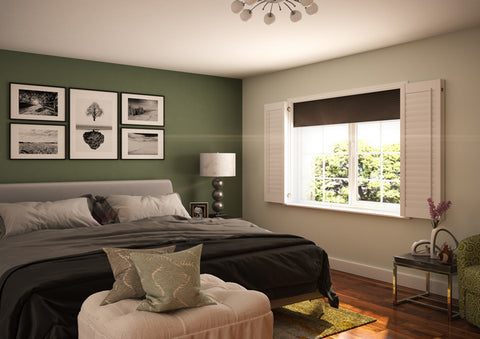 bedroom with green wall open shutters and blackout blinds