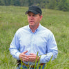 Dr. Allen Williams Ph.D. standing on pasture