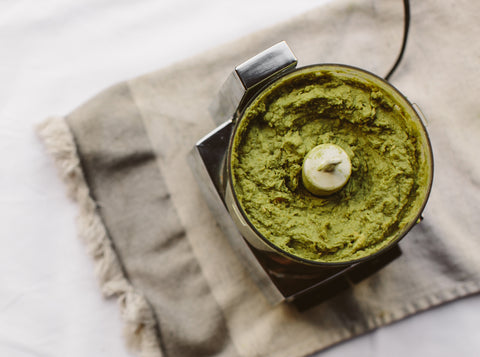 Creamy avocado wheatgrass hummus with wheatgrass blender