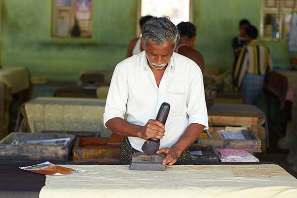 A Kalamkari block printer at work