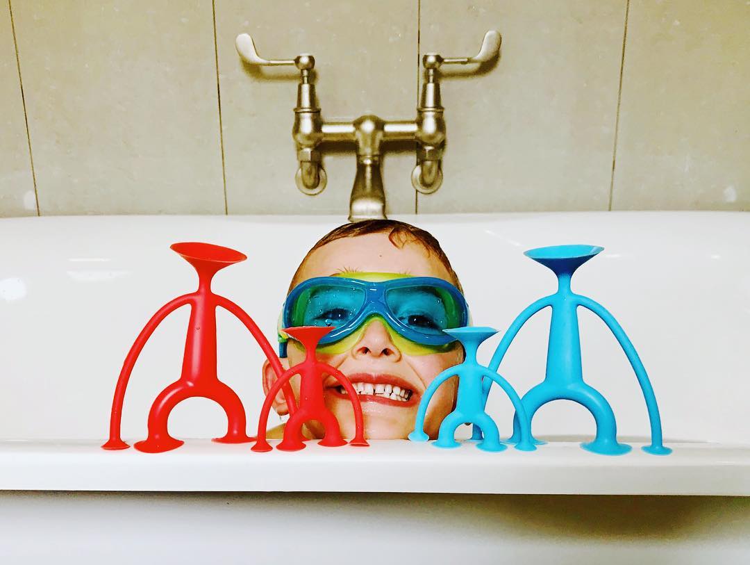 6 year old boy in goggles and the Oogi Family Toys