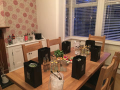 Gin tasting table with goodie bags, tonics and garnishes