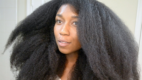 Youtube vlogger Naptural85 with a blow out before using a flat iron