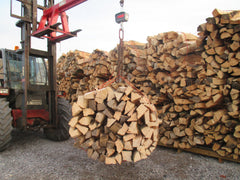 Kiln dried log bales stacked 