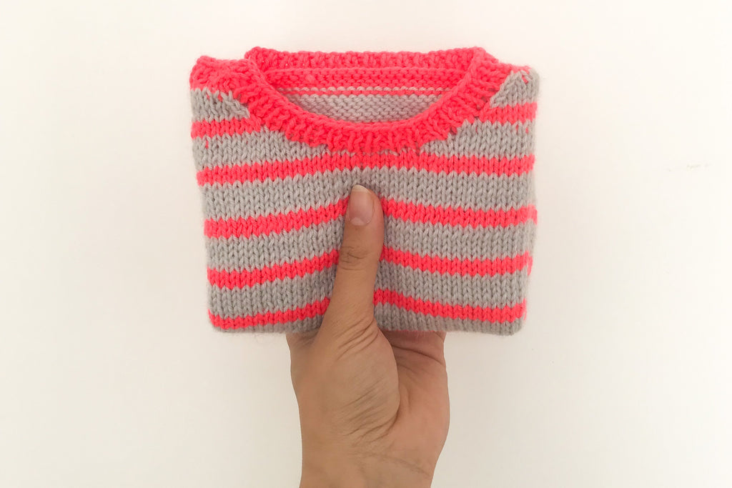 Folded striped baby jumper