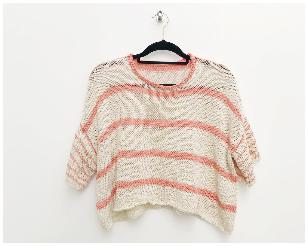 Cream and Peach striped handknitted tee on hanger