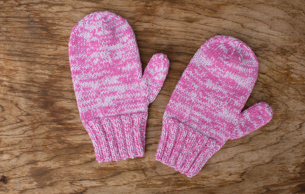 Pink and white mittens. Handmade by the TOM BIHN Ravelry group for the TOM BIHN crew.