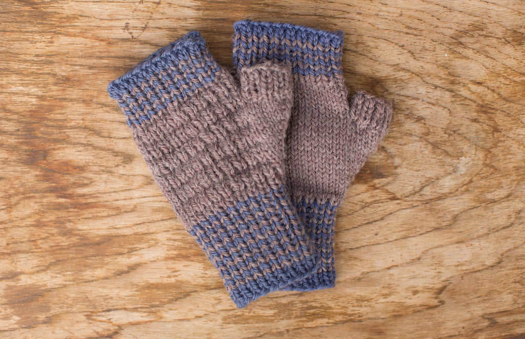 Blue and natural tan fingerless mittens. Handmade by the TOM BIHN Ravelry group for the TOM BIHN crew.
