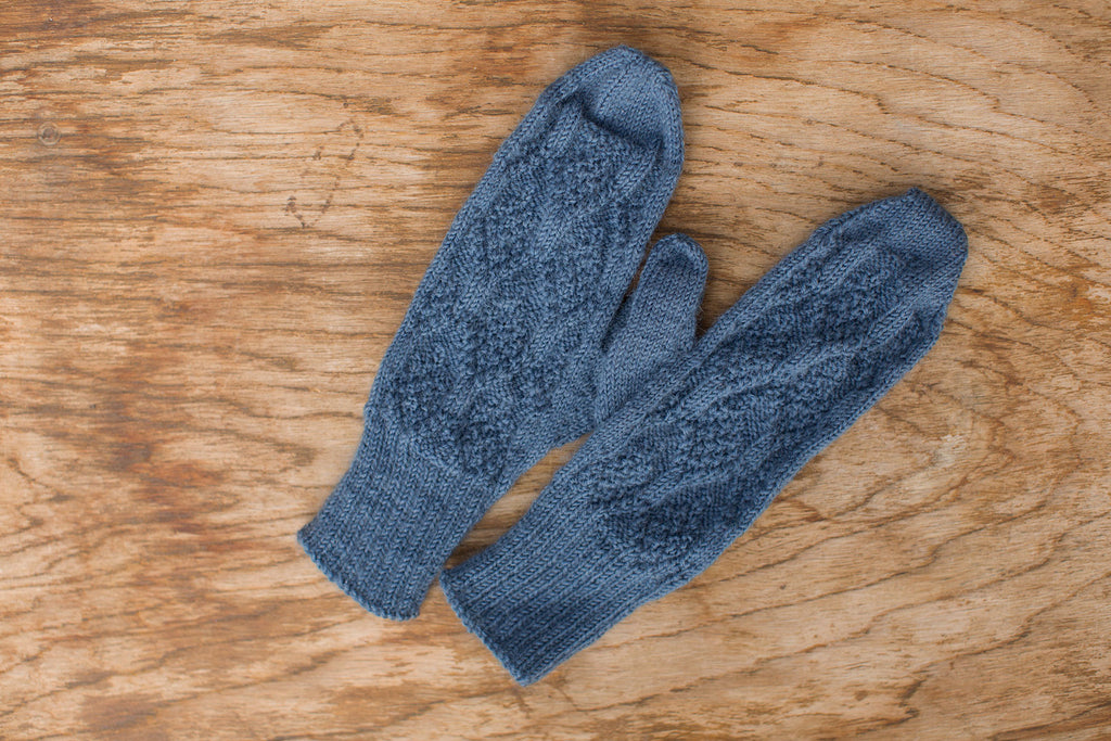 Medium blue knit mittens. Handmade by the TOM BIHN Ravelry group for the TOM BIHN crew.