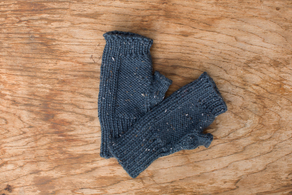 Blue with specks fingerless gloves. Handmade by the TOM BIHN Ravelry group for the TOM BIHN crew.