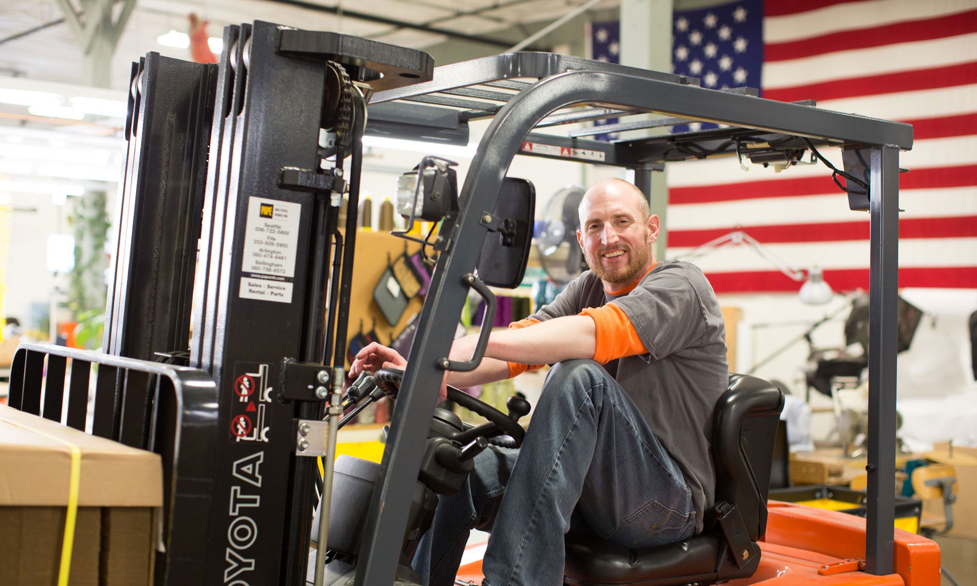 Ben driving a forklift