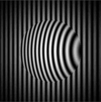 An optic placed in front of a reference transmission flat demonstrates the distortion of the fringe pattern as light travels through the optic.